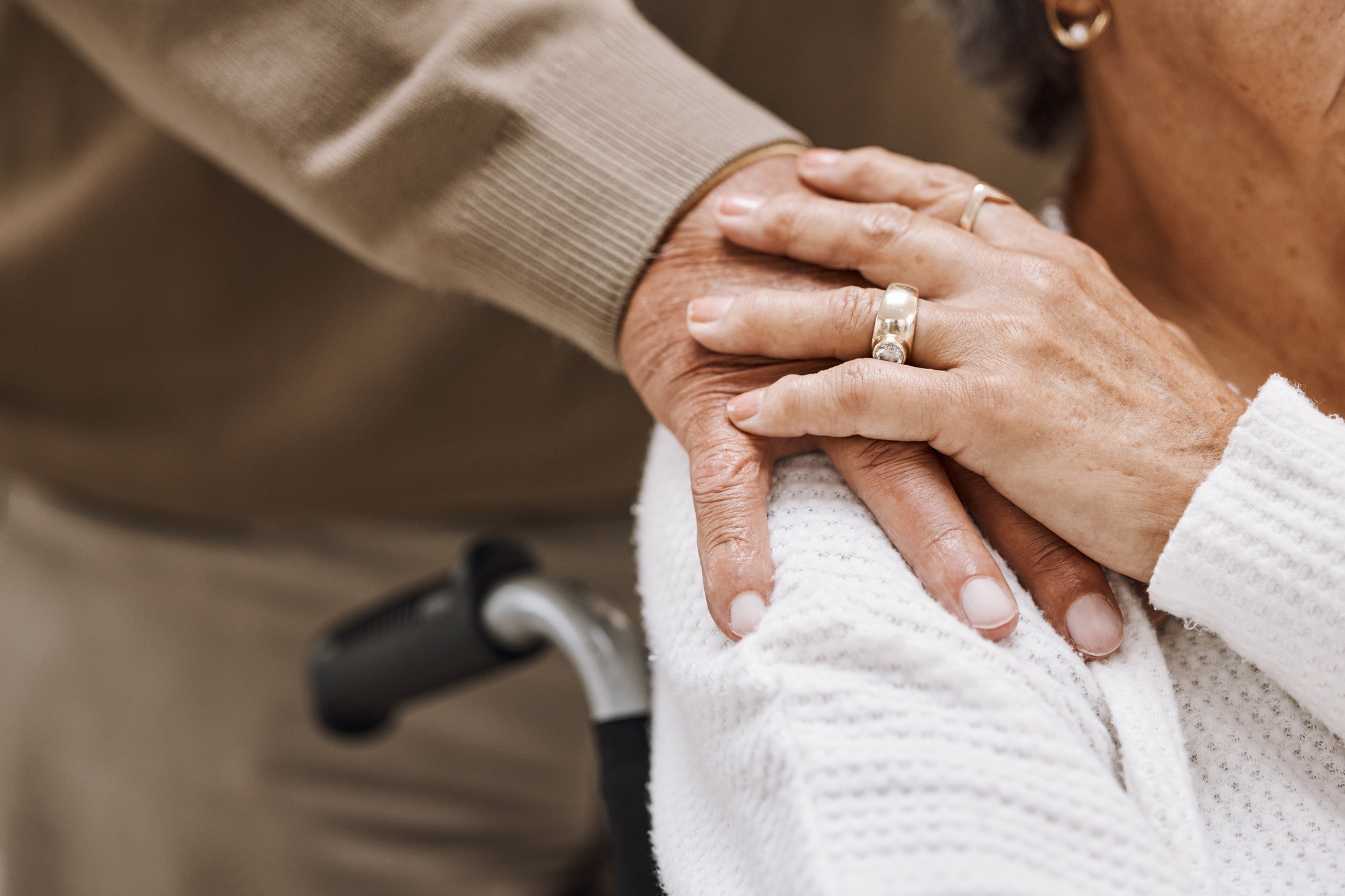 Love, disability and hands of retirement couple with care, gratitude and support in marriage. Unity